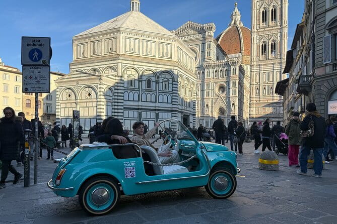Discover Florence city center on e-cabriot fiat 500 - Stop 3: Santa Maria Novella for marble patterns and major artists
