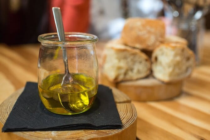 Florence Central Market Food Tour with Eating Europe - Le Lame stand at Mercato Centrale: olive oil, vinegars, wine