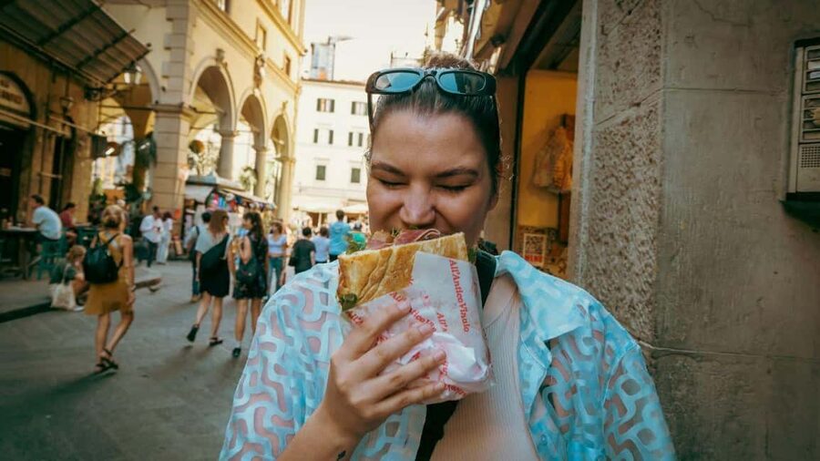Florence Foodies Tour: Savor Tuscan Flavors & Fine Wine - The last course: cookies, a wine window, and Vin Santo to close the loop