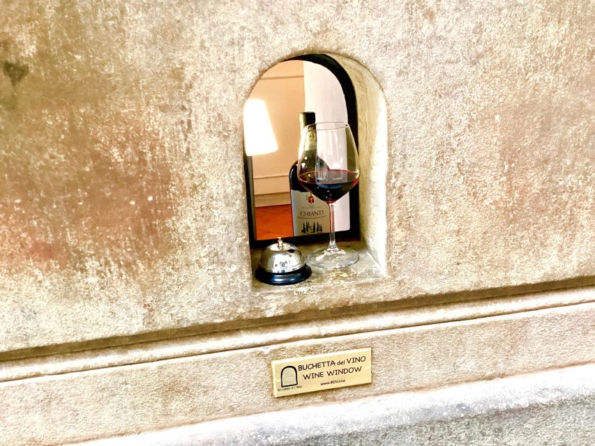 Florence: Wine Windows Walk with Wine Tasting and Appetizers - The historic wine window pour: the moment you plan the whole trip around