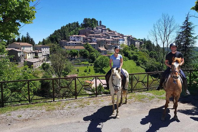 Half-Day Horseback Ride in Tuscany - Getting ready to ride: helmets, a quick lesson, and horse matching